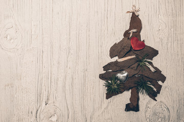Christmas tree on rustic wooden backgroun with copy space