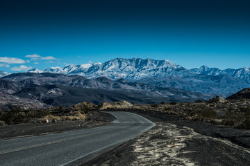 Road Leading to a Snowy Peak in Death Valley National Park