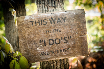Rustic wooden wedding sign with witing.
