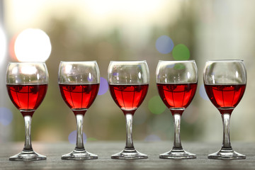 Wine glasses with wine on a table outside