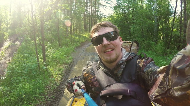 Two Man on ATV in forest video Selfe