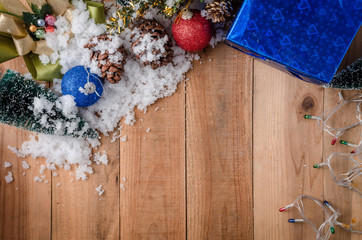 Christmas background with decorations on wooden panel