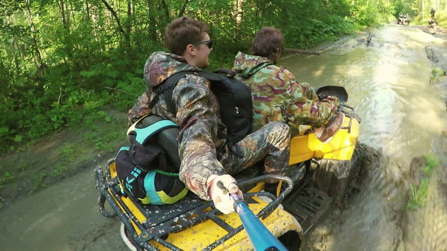 Two Man on ATV in forest video Selfe