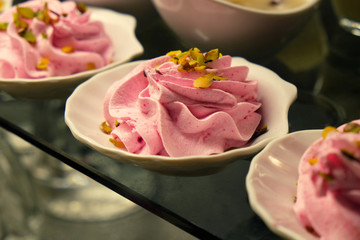 Different creamy dessert for sale at the shop