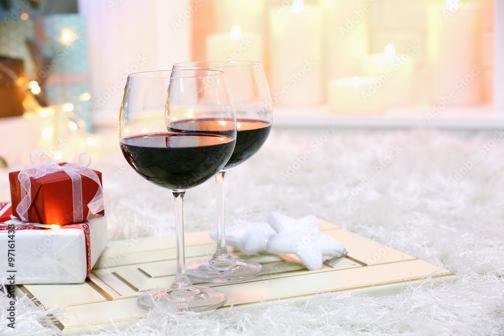 Poster two glasses of mulled wine on christmas decor background