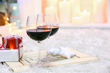 Two glasses of mulled wine on christmas decor background