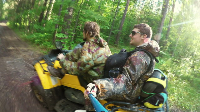 Two Man on ATV in forest video Selfe