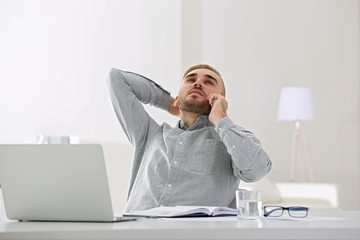 Businessman working with laptop in office