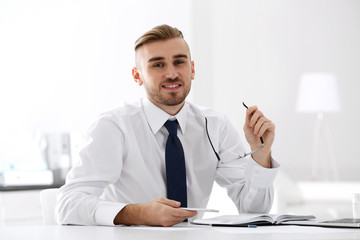 Businessman working with laptop in office