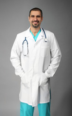 Portrait of a doctor on grey background