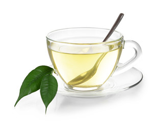 Glass cup of tea with green leaves isolated on white background