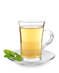 Glass cup of tea with mint leaves isolated on white background