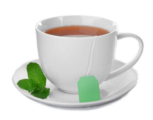 Ceramic cup of tea with mint leaves isolated on white background