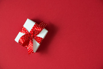 Gift box with red ribbon