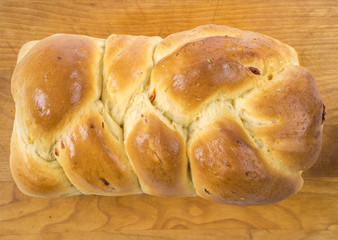 Freshly Homemade Herb and Sun Dried Tomato Bread Cooling Off on a Cutting Board