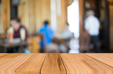 Fototapeta premium Selected focus empty brown wooden table and Coffee shop blur bac