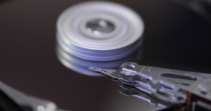 Loopable close up of a computer hard drive with the casing off.
