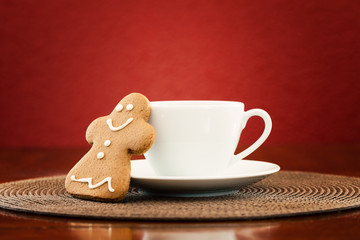 Gingerbread cookie with cup of coffee