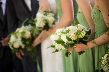 Bridesmaids and brides with beautiful green, pink and white rose