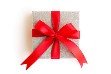 Silver gift box with red ribbon