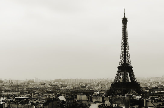 Eiffel tower and Paris roofs in black and white