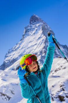 Skier girl with view of Matterhorn on a clear sunny day - Zermatt, Switzerland
