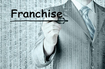 business man writing franchise