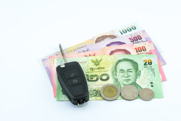 Car key with the Thai baht. Isolated on white background