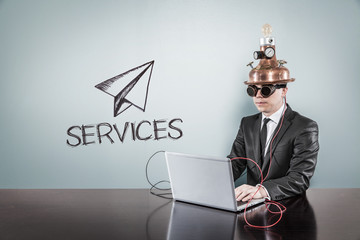 Services concept with vintage businessman and laptop
