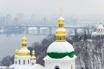 Fototapeta na wymiar Domes of Kiev Pechersk Lavra in winter