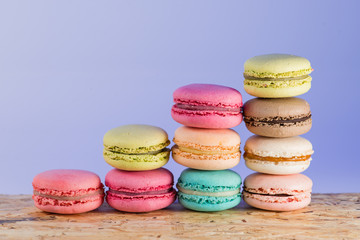 series Colorful and tasty French cookies Macarons on a colorful
