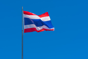 Thai flag of Thailand with blue sky background