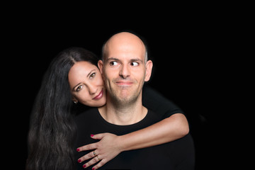 Portrait of couple in love on black background