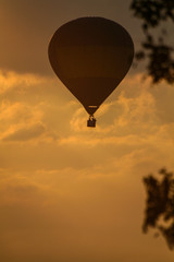 Balloon silhouette with sunset background.