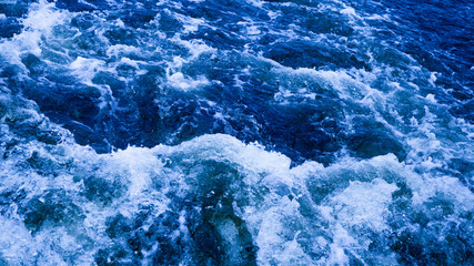blue water bubbling and foaming