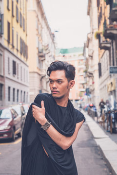 Handsome Asian model posing in the city streets