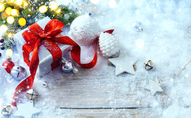 Christmas gift boxes on snow background and holidays light