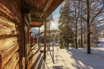 Fototapeta na wymiar Beautiful mountain cottage of wooden logs