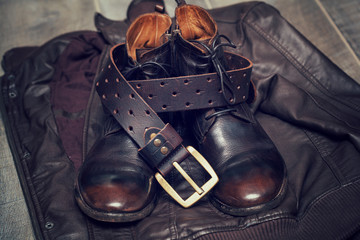 Men's leather jacket, high boots and a leather belt with buckle