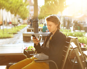 Young man with a shopping cart in a supermarket 