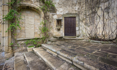 Fototapeta na wymiar Vintage trujillo stone facade and stairs