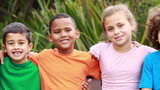 Smiling pupils sitting on bench