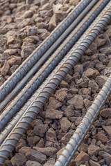 Steel rods or bars used to reinforce concrete