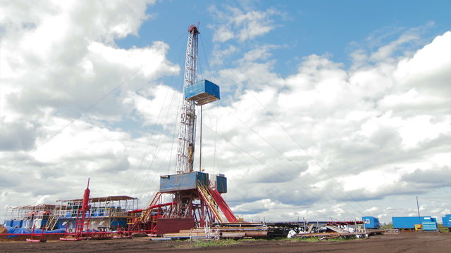 4K Timelapse clouds over drilling rig