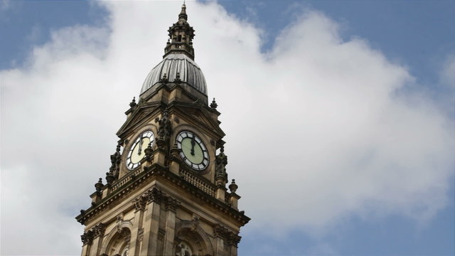 The clock tower of Bolton town hall, Lancashire, in  the half-minute leading up to 12 o'clock, noon: real time, no audio.