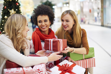 Woman receiving a gift from her friend.