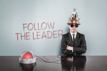 Follow the leader concept with vintage businessman and calculator