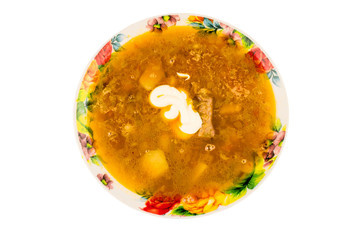 Soup - borscht with sour cream in the plate