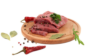 Meat on a cutting board on white background.