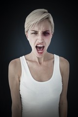 Composite image of angry blonde woman screaming 